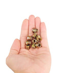 Hand holding 40Pcs 1/4-20 X 10mm Wood Threaded Inserts Fastener Kit With Hex Socket Drive And 6mm Hex Spanner For Furniture DIY Repairs