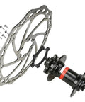 Boost Hub Conversion Adapter For Front And Rear Wheels, Converts 100mm By 15mm To 110mm By 15mm Or 142mm By 15mm To 148mm, Aluminum Alloy, 6 Hole, Spacers And Screws Included, shown with rotor.