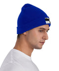 Kick Cold Weather To The Curb With This Straight Up Cozy Black And White Piano Plate Grid Knit Hat Crafted From Ultra Plush Acrylic Fiber For No Cap Winter Warmth Indoors Or Stepping Outside, blue knit beanie worn by man.