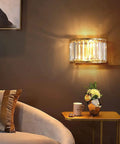 BUNCC Modern Minimalist Metal Wall Sconce, E14 LED Crystal Indoor Wall Light Fixture mounted beside a stylish sofa.