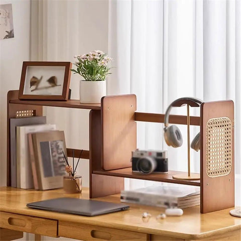 Expandable Bamboo Bookshelf Organizer For Your Home Office with books and decor on a wooden desk.