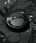 Matte Black 16 By 12 Inch Vessel Sink And Faucet Combo For Above Counter Vanity With Modern Square Rectangle Basin Porcelain Ceramic Durable Construction Includes Pop Up Drain, close-up of pop-up drain with glossy water surface
