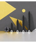Premium Heavy Duty Black Carbon Steel Phillips Wood Screws Self Tapping Countersunk Fasteners M3 X 6mm angled view on display.