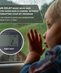 Child looking out window with rain delay display for Programmable Sprinkler Timer For Garden Hose Faucet With Rain Delay