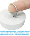 Hand holding a Heavy Duty Rubber Bathtub Drain Stopper And Sink Plug 1 Half Inch Tub Drain Cover for sizing.