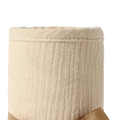 Close-up of beige cotton gauze Cot Rail Protector Two Piece Set Breathable Cotton Gauze With Adjustable Straps Soft Bed Edge Guard.