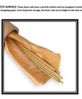 Two brass round rods, 8 mm diameter, 12 in length, partially unwrapped from brown paper.