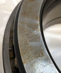 Close-up of Thrust Ball Bearing 150 mm Bore Open Brass Cage For Easy Lubrication ABEC 5 Precision detailing surface texture.