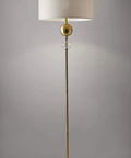 Chole Floor Lamp 69 Inch Tall with antique brass finish, clear glass globe, off white textured shade, 3 way rotary socket.
