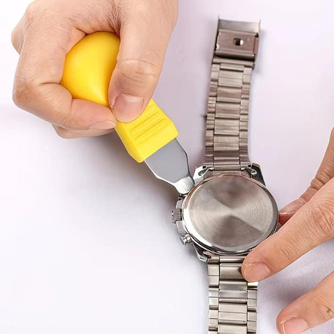 All In One Hand Tool Watch Repair Kit For Precision Back Cover Opening And Lifting shown in use on a metal watch.