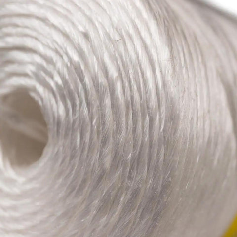 Close-up of heavy duty polypropylene twine rope for outdoor use gardening landscaping and shipping 1000 ft white tube 135 lb tensile strength