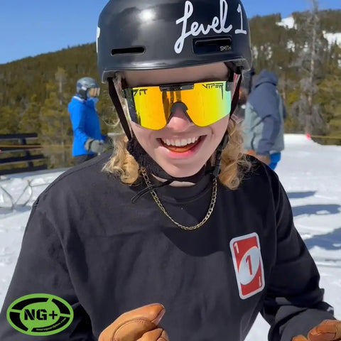 A person smiling on a ski slope wearing sunglasses and a helmet. "Mouthguard For Peak Performance And Jaw Protection, Reduces G Forces" is used.