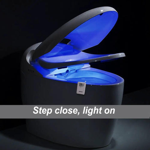 Three Pack 16 Color Motion Sensor LED Toilet Night Light With Auto On Night Glow illuminating open toilet lid
