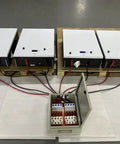No Sweat 500A DC Combiner Box 4 To 2 Out Pre Wired Cable Kit For 48V Lifepo4 Battery Bank with connected cables on pallet.