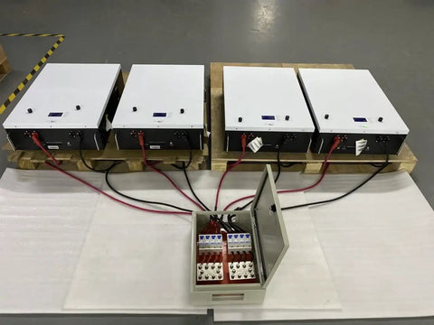 No Sweat 500A DC Combiner Box 4 To 2 Out Pre Wired Cable Kit For 48V Lifepo4 Battery Bank with connected cables on pallet.