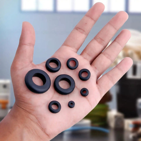 Hand holding 180 Pcs Rubber Grommets Kit In Eight Sizes For DIY Auto Wiring And Cable Protection Drill Hole Sizes One Quarter Inch Through One Inch Premium Flexible Rubber Grommets Assorted Set