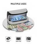 Counterfeit Money Detector With UV LED Light scanning cash, bank cards, and ID cards on mirror surface for verification.