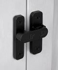Sturdy Black Zinc Alloy Barn Door Latch With 180 Degree Slide Lock For Wood Doors mounted on white panels, showing screws and sleek design.