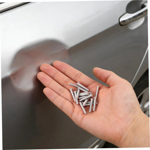 Top Picks For Car Body Repair Welding Studs 50 Pack 4mm Metal Pulling Pins for Dent Removal displayed in hand near a car dent.