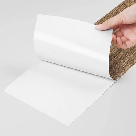 Wood Look Peel And Stick Vinyl Plank Flooring 6x36 Inches, Waterproof Self Adhesive Tiles detail with backing peeled.
