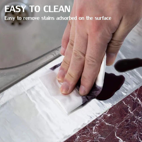 Hand wiping liquid on Heavy Duty Aluminum Foil Tape For HVAC Ducts 2 Inch By 164 Foot 4 Mil Pro Grade Sealing Patch And Repair For Ductwork Heat Resistant Air Ducts Dryer Vents Refrigerator.