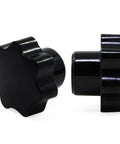 Two black star-shaped screw-on clamping knobs, plastic; front and side views.