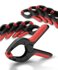 10 Pack Mini Spring Clamps With 1 Inch Opening And Pivoting Jaw Pad EZ Grip Plastic Clips for secure holding, close-up view