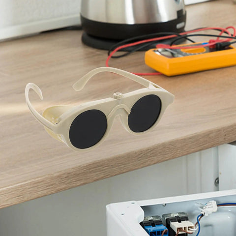 Built Tough Welding Glasses And Protective Goggles For Industrial Grinding, Super comfy beige goggles on work surface.