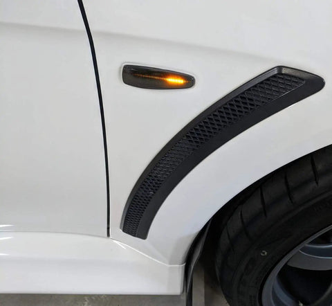 Smoked Amber LED Side Marker Light Assembly on Mitsubishi Lancer Evo X with 36 SMD LEDs and black smoke lens.