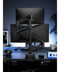 Hella Stable Dual Monitor Mount For Desktop Setup Vertical And Inverted Stand With Slick Swivel Mechanism And Heavy Duty Clamps. Dual monitor setup with heavy-duty clamps on a desk.