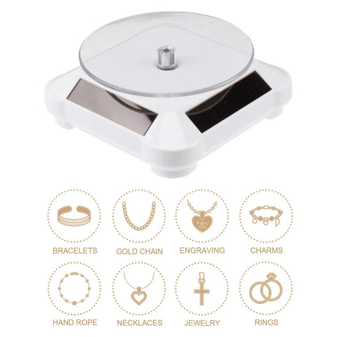 Ipetboom Battery Free Rotating Display Stand Electric Jewelry Showcase Solar Powered Turntable with clear acrylic top and white base.