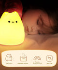 LED Cat Night Light For Kids Battery Powered Silicone Cat Nursery Night Light With 2 Soft Glow Modes next to sleeping child