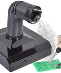 Heavy Duty Soldering Fume Extractor With Flex Hose Knocks Fumes Out Clean Slick Dust Catcher For Nail Grinding And Board Repairs Top Shelf Workshop Air Scrubber With Bright Led Light capturing smoke above a green circuit board.