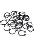 A pile of Heavy Duty External C Type Circlip Retaining Rings For Shafts Built To Last Burr Free Surface Carbon Steel Black Finish