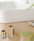 Cool Brass Pipe Fitting Lock Nut Kit With 10 Hex Female Thread Parts For Sink And Faucet Repair Plus Gas Water Oil Connection Seals That Stop Leaks Dead For Your Plumbing Needs brass fittings shown with two threaded brass posts and seals on a wooden surface