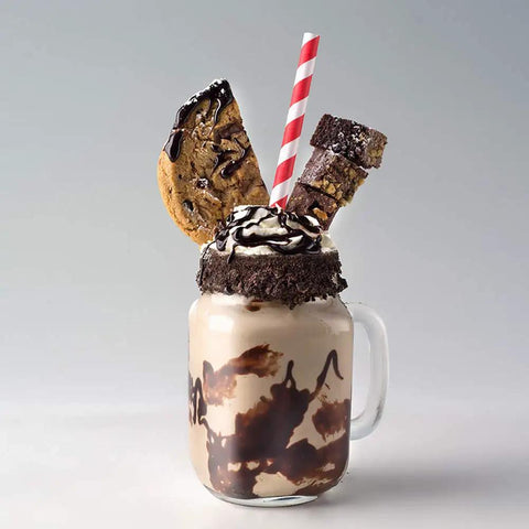 Mason jar milkshake with chocolate toppings, decorated with a straw from Patriotic Paper Straws 100 Pack With Red Blue White Flag Designs 7.75 Inch Biodegradable