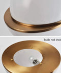 Close-up of gold mount and acrylic globe design for Three Acrylic Globe Pendant Lights With Irregular Hanging Design For Dining Room.