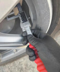 Measuring with Digital Disc Brake Rotor Caliper with Large LCD Screen, hand holding tool near brake rotor.