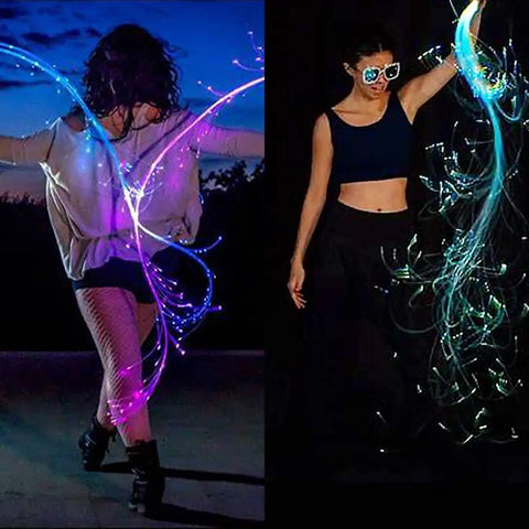 Dancers with Lit Fiber Optic Space Dancing Light Whip with Rechargeable LED, 5.9Ft Rave Toy for Parties, performing at night.