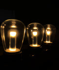 Outdoor Waterproof S14 LED Decorative Bulb Warm White 2400K 1W Low Wattage 10W Equivalent E26 Base Shatterproof Landscape Sign Bulbs 25 Pack For Curb Appeal And Chill Patio Vibes glowing in darkness