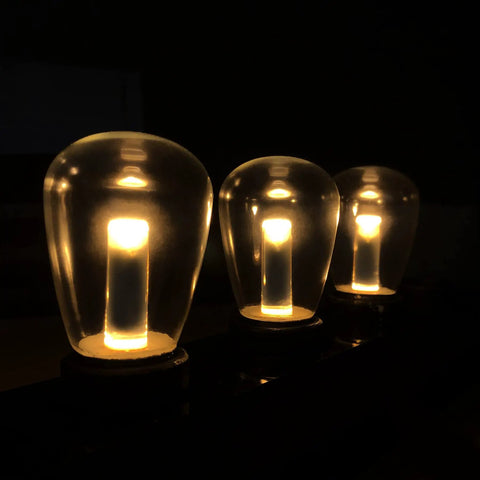 Outdoor Waterproof S14 LED Decorative Bulb Warm White 2400K 1W Low Wattage 10W Equivalent E26 Base Shatterproof Landscape Sign Bulbs 25 Pack For Curb Appeal And Chill Patio Vibes glowing in darkness