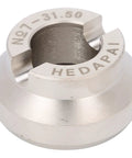 Close-up of a 31.5mm alloy steel watch opener die for case back removal with visible engravings