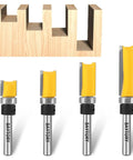Top Shelf Pattern Flush Trim Router Bits Set Featuring Dead Nut Tight Carbide Cutters And Smooth Riding Bearings For Zero Tear Out Custom Woodworking Projects with four router bits over wood.