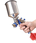Hand holding spray gun with attached 10 Pack Disposable Mini Air Water Trap Filters With 1/4 Inch Threads For Spray Guns.