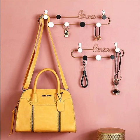 Gotta Have These Killer Wrought Iron Love Wall Hooks For Keys Hats And Scarves With A Totally Dope European Touch Black Metal Row Bar For Your Entryway Flex Size 39X8cm with a yellow handbag and accessories.