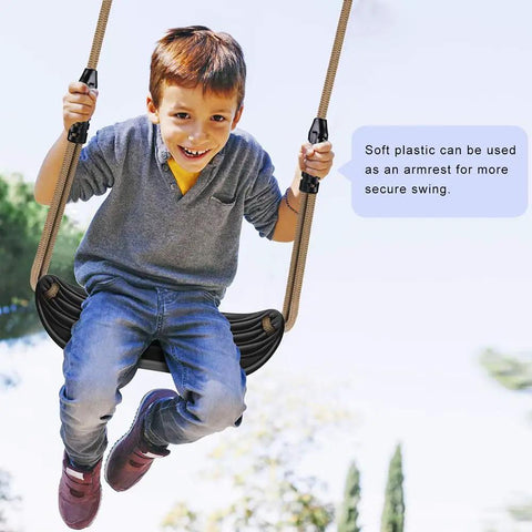 Child swinging on heavy duty plastic swing seat with non-slip design, adjustable rope, built for indoor or outdoor playsets.