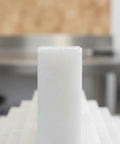 Close-up of white soapstone marker for steel, showing heat-resistant industrial design for metal fabrication work.
