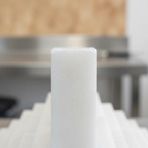 Close-up of white soapstone marker for steel, showing heat-resistant industrial design for metal fabrication work.