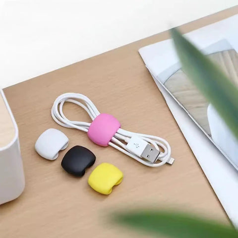 Multi Pack Cable Clips For Travel, Desk, And Home, Cord Management Made Easy With Versatile Wire Holders on a wooden desk.