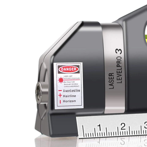 Pro Grade Laser Level With Multipurpose Tape Measure And 8 Ft Line, Standard And Metric Rulers, Battery Update Ready, Pinpoint Accuracy, 3 Pronged Leveling Bubble, DIY Friendly Measuring Tool For Quick Projects close-up with ruler and laser warning label